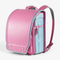 Sac randoseru japonais rose vue trois quarts 26 x 16 x 36 cm