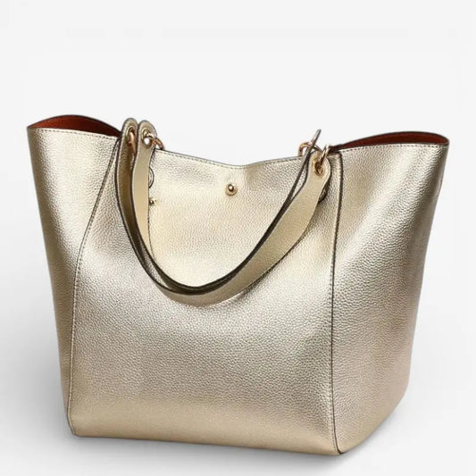 Vue de face du sac cabas porté épaule femme couleur champagne or, effet métallisé.