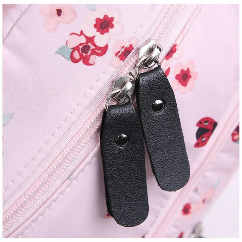Détail des fermetures zippées du sac à dos collège à fleurs