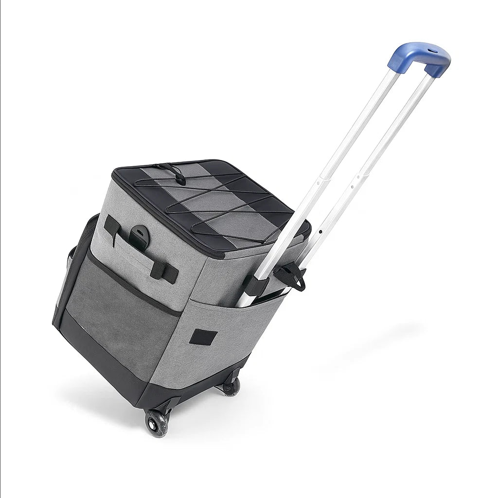 Glacière isotherme grise tirée en inclinaison avec poignée télescopique et roulettes