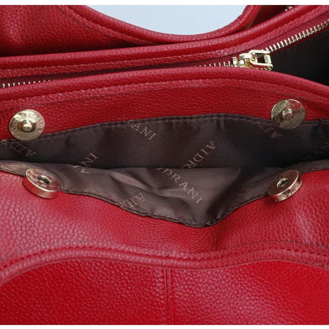 Intérieur du sac cabas en cuir rouge avec poches et fermeture