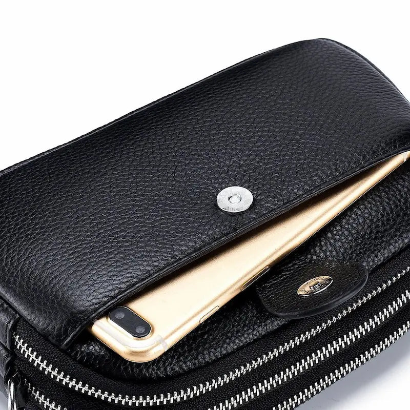 Petit sac en cuir véritable noir avec poche zippée contenant un téléphone