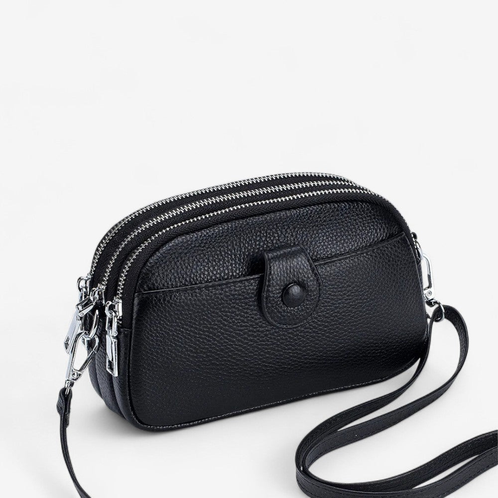 Petit sac en cuir véritable noir avec trois poches à fermeture éclair et bandoulière réglable