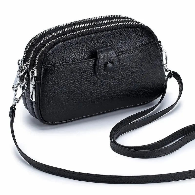 Petit sac en cuir véritable noir avec trois poches à fermeture éclair et bandoulière réglable