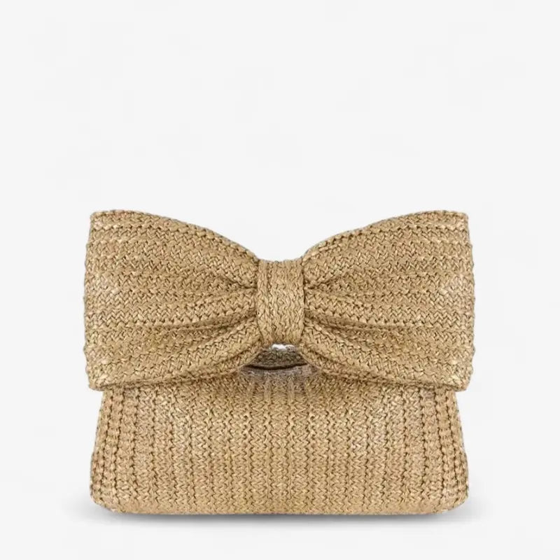 Pochette en paille tressée avec grand nœud décoratif et format compact