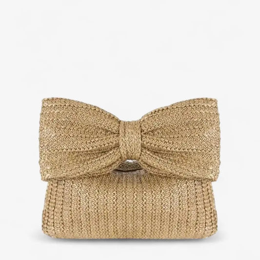 Pochette en paille tressée avec grand nœud décoratif et format compact
