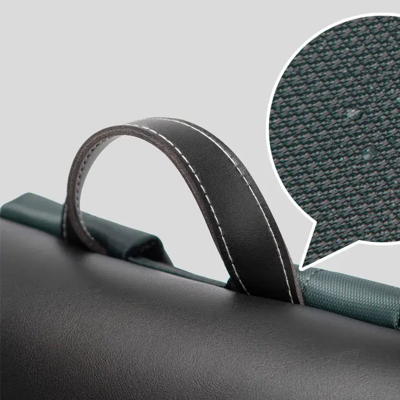 Détail de la poignée du sac à dos business homme avec texture résistante et coutures contrastées
