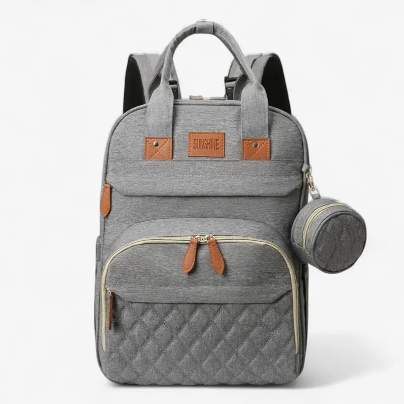 Sac à dos à langer 3 en 1 gris vu de face avec poches et pochette ronde