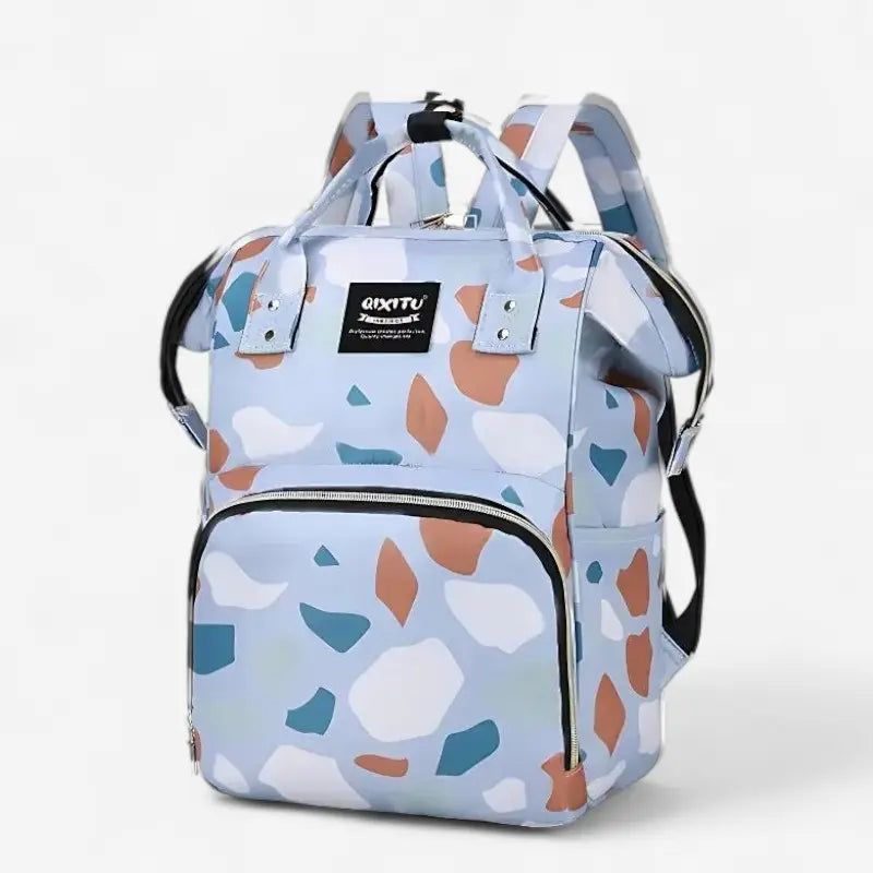 Sac à dos à langer étanche blanc avec motifs géométriques colorés