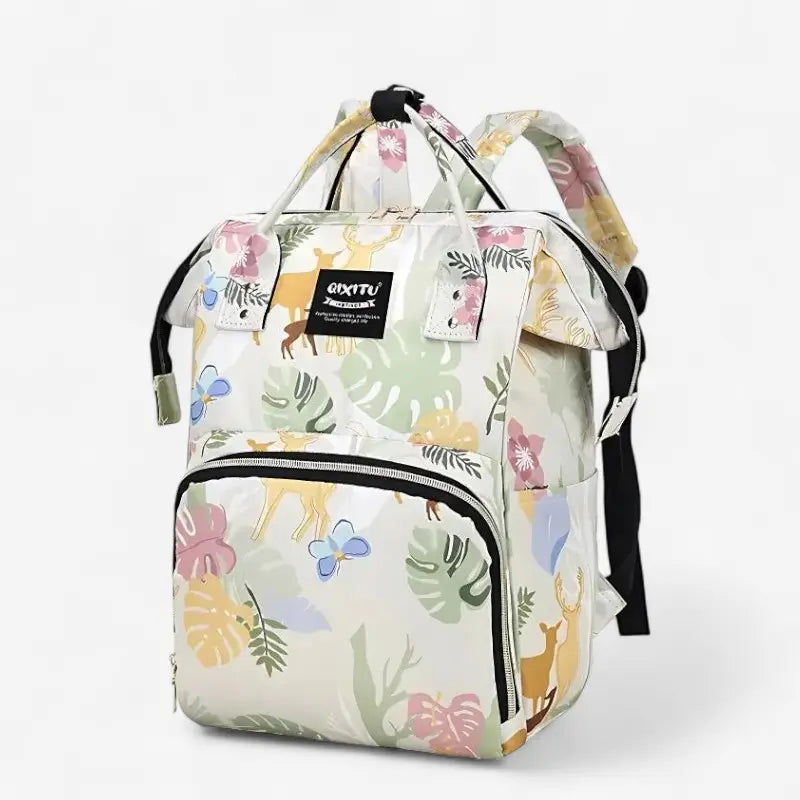 Sac à dos à langer étanche vert clair avec motifs feuilles tropicales