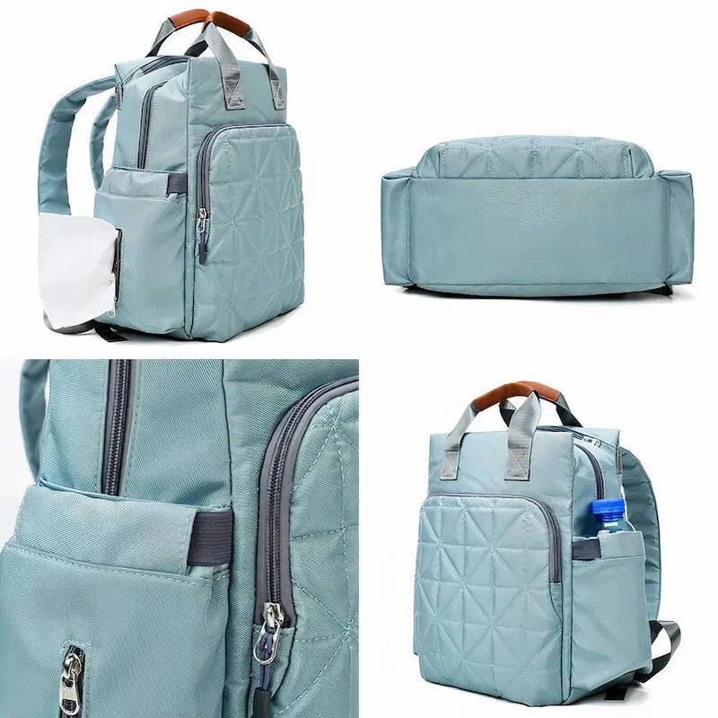 Sac à dos à langer gris clair avec accessoires, poches latérales et ouverture zippée