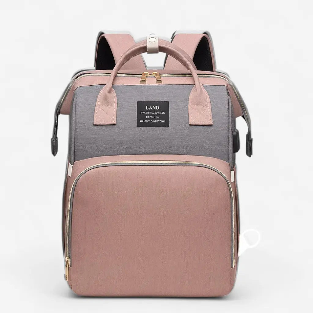 Sac à dos à langer bicolore gris et rose avec lit intégré, vue de face