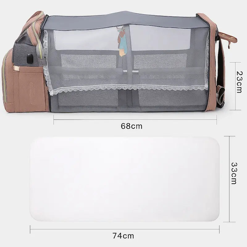 Sac à dos à langer rose et gris transformé en lit bébé avec moustiquaire
