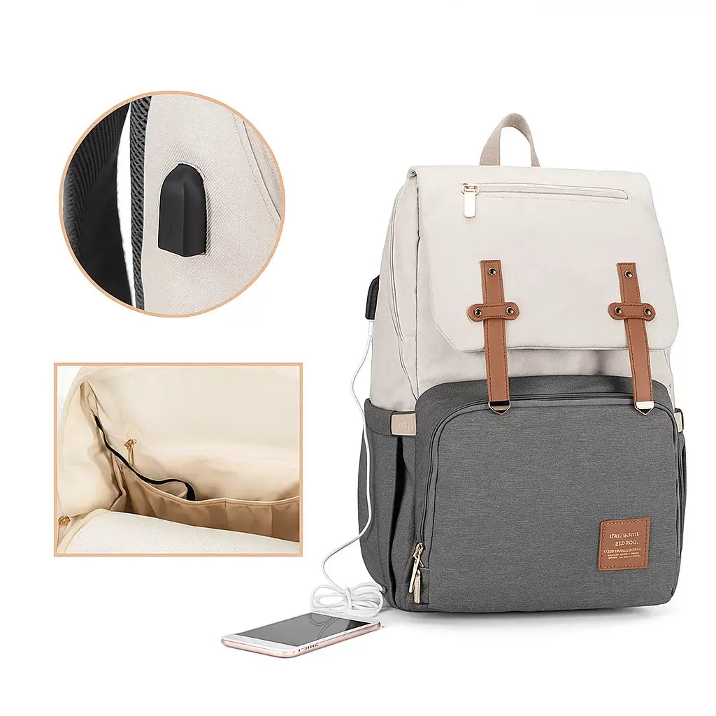 : Détail du port USB chauffant sur le côté du sac à dos à langer gris et beige