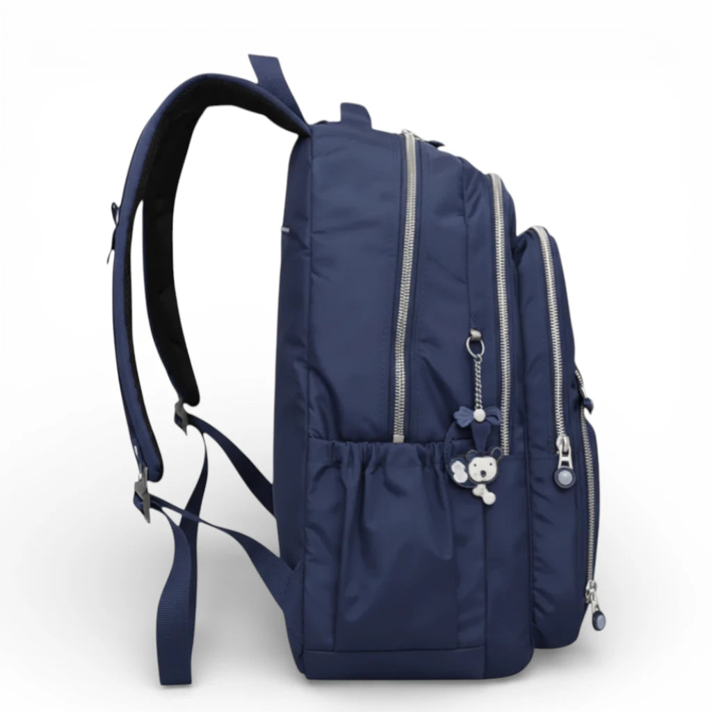 Sac à dos scolaire bleu marine vue latérale avec poche bouteille