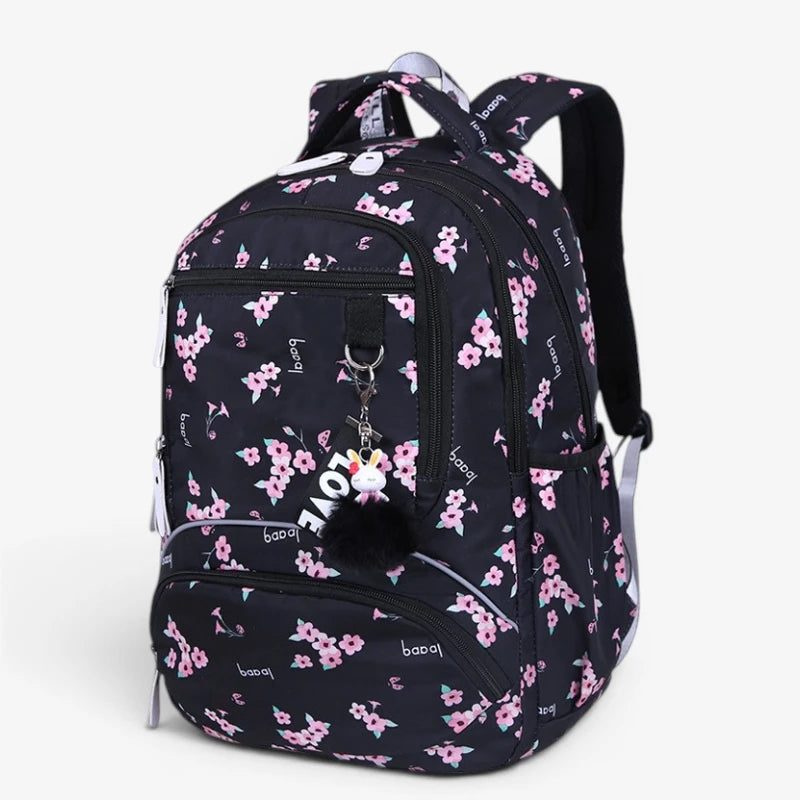 Vue avant du sac à dos collège noir à fleurs avec poches zippées