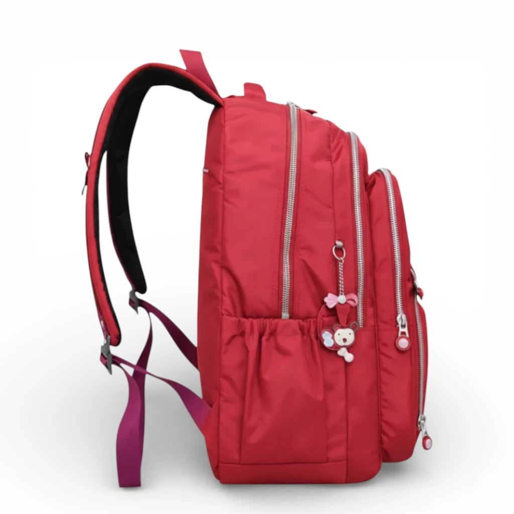 Sac à dos scolaire rouge vue latérale avec poche bouteille