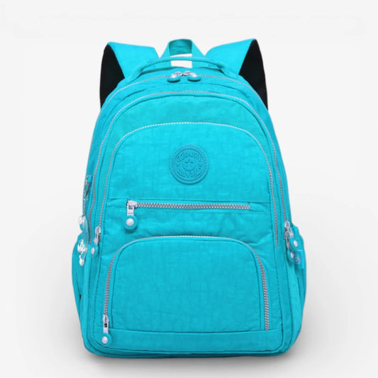 Sac à dos collège fille turquoise grande capacité en nylon imperméable avec multiples poches zippées