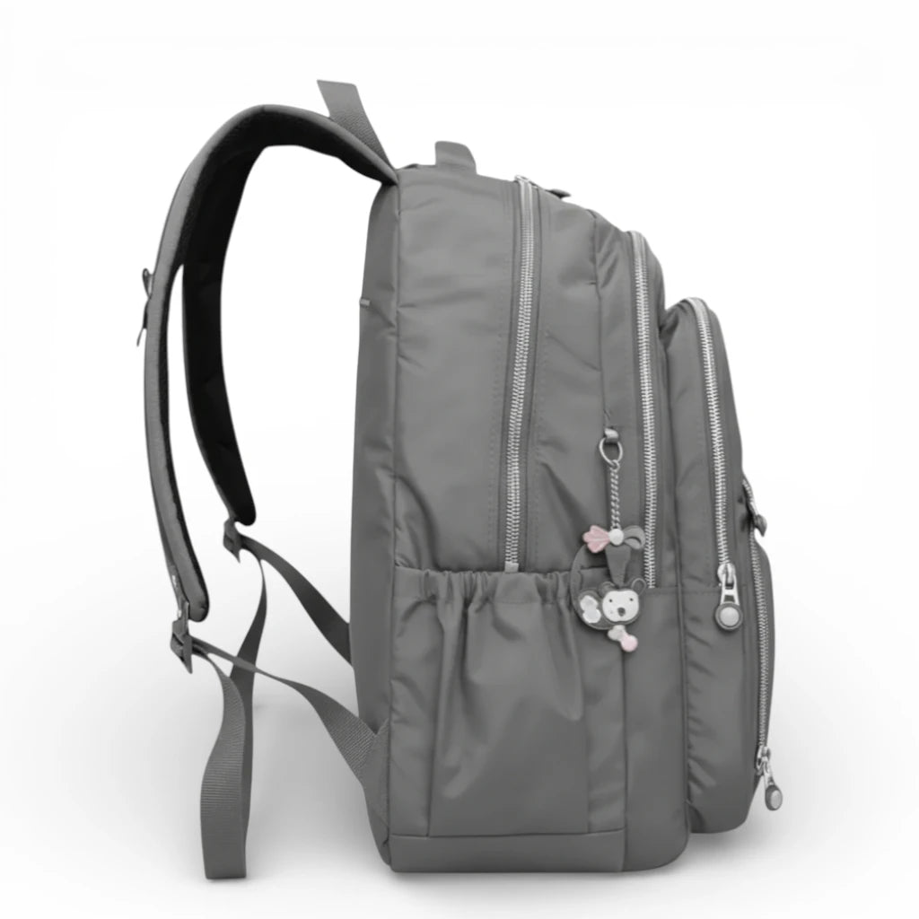 Sac à dos scolaire gris vue latérale avec poche bouteille