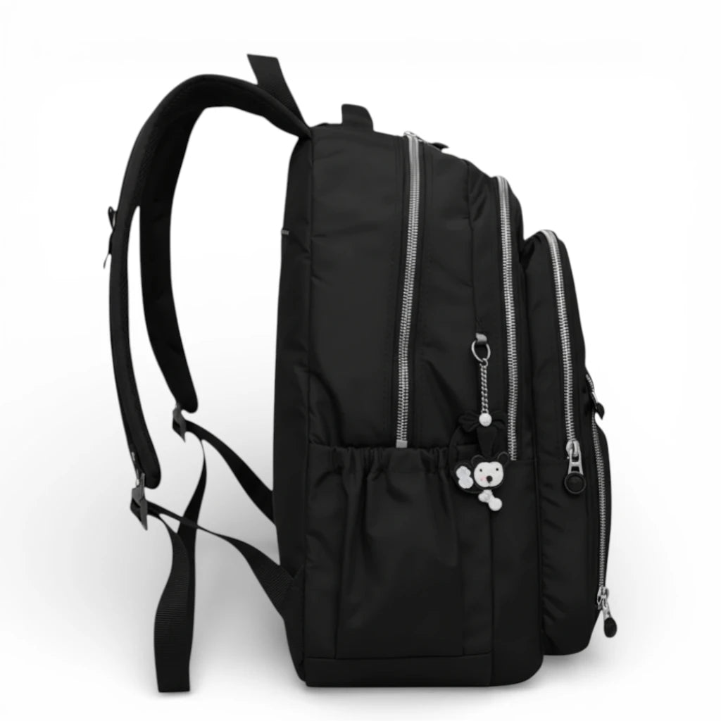 Sac à dos scolaire noir vue latérale avec poche bouteille