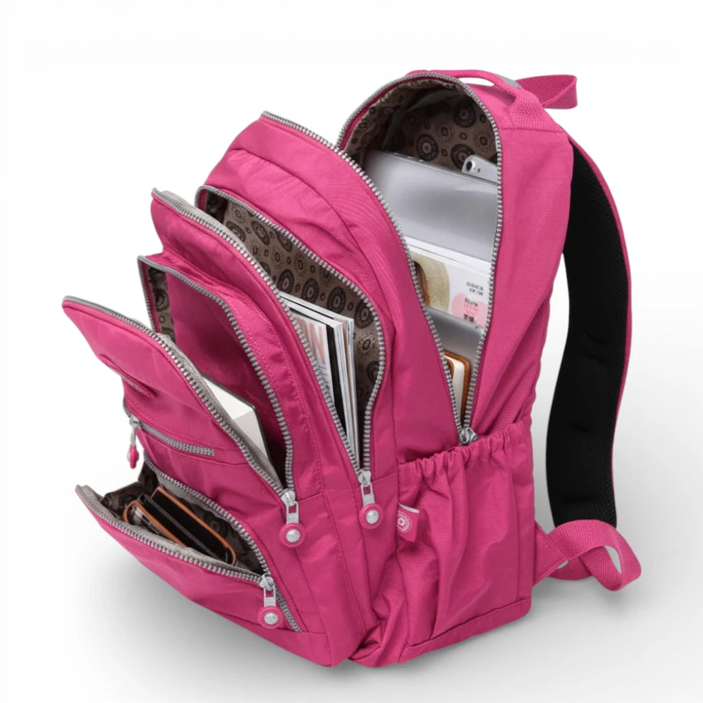 Sac à dos scolaire rose 35L avec compartiments multiples et rangement organisé