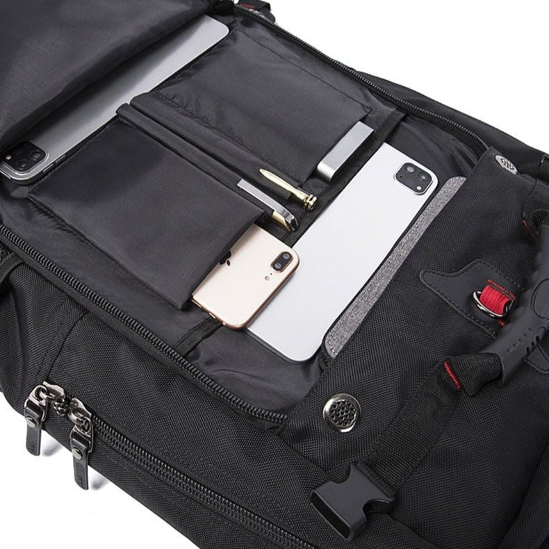 Intérieur du sac à dos étanche 50L avec compartiments pour stylos, téléphone et accessoires