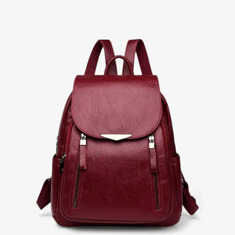 Sac à dos femme en cuir synthétique bordeaux avec rabat et fermetures contrastées