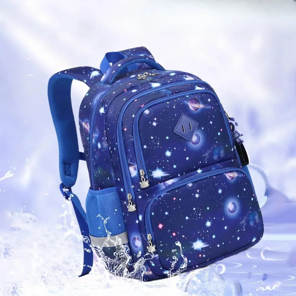 Sac à dos scolaire enfant bleu motif galaxie, imperméable et résistant à l’eau.