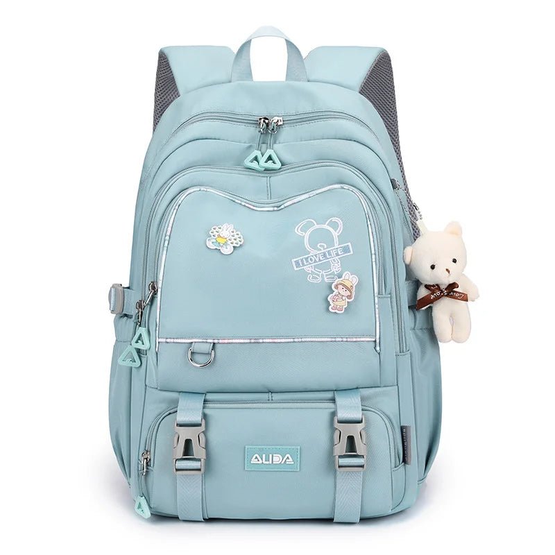 Sac à dos scolaire fille bleu clair avec peluche ours accroché