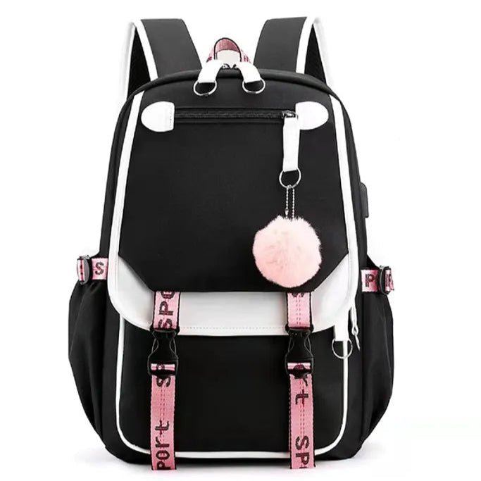 Sac à dos scolaire noir et blanc avec port USB et pompon décoratif, vue de face.