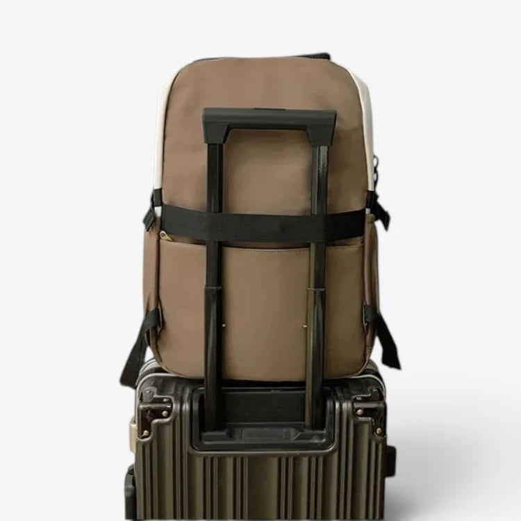 Sac à dos scolaire fixé sur une valise avec poignée télescopique