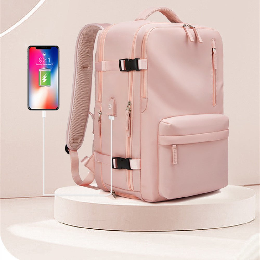 Sac à dos de voyage extensible 23-39L rose vu de côté avec port USB intégré