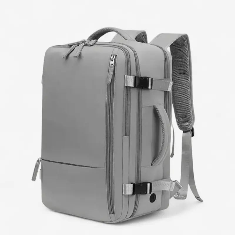 Sac à dos de voyage mixte gris vu de profil avec poches latérales