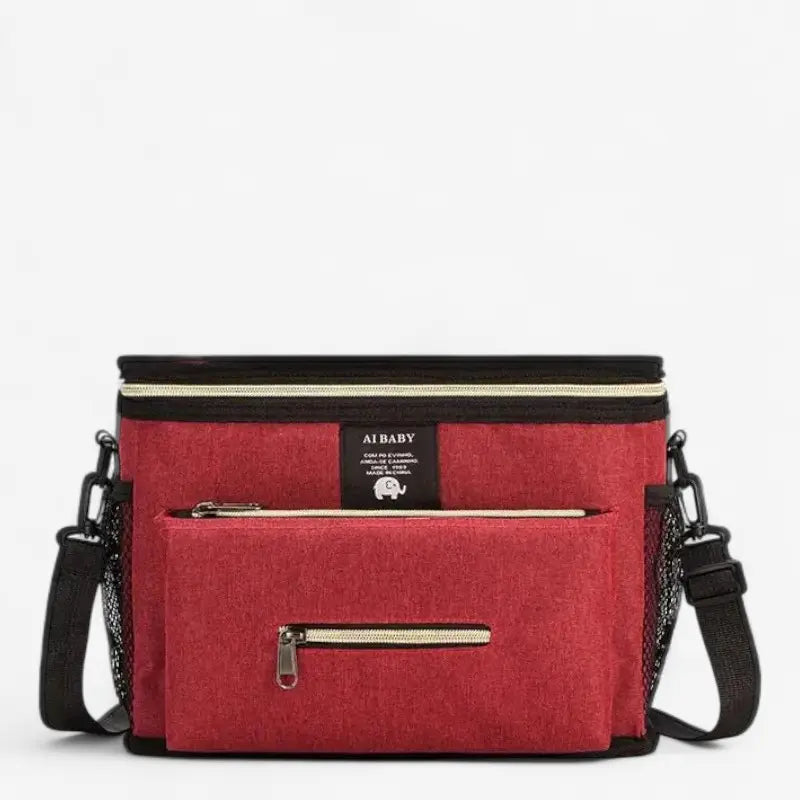 Sac à langer bandoulière rouge avec poche frontale zippée et sangles latérales