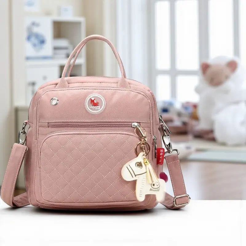Sac à langer bébé rose matelassé élégant avec bandoulière