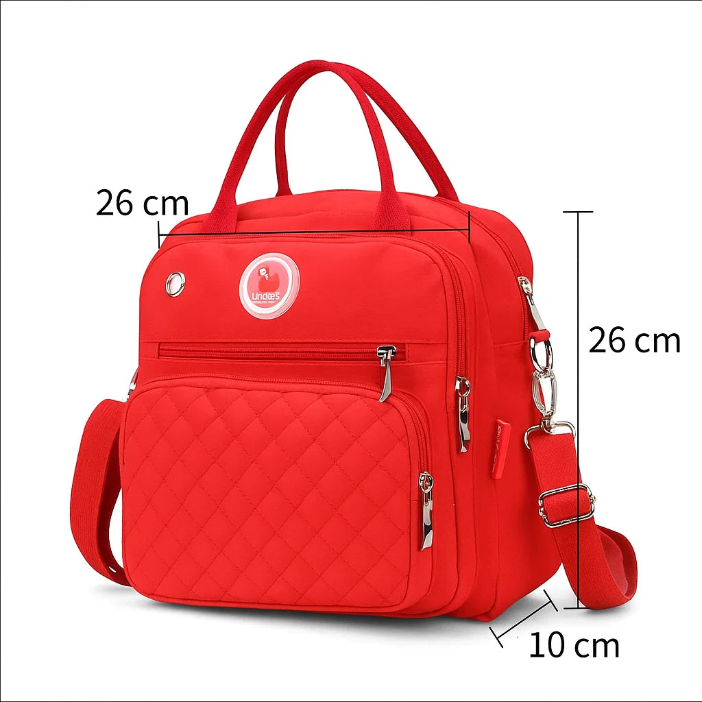 Sac à langer bébé rouge élégant avec couture matelassée et poche frontale dimension 26 x 26 x10 cm