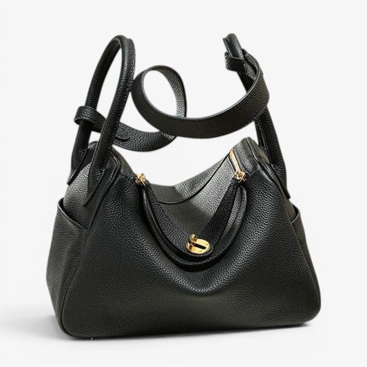 Sac bandoulière femme en cuir de vachette noir avec fermoir métallique couleur or