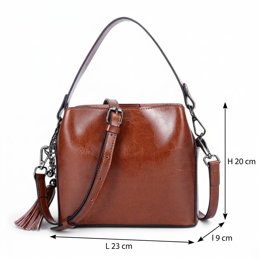 Sac bandoulière en cuir marron avec anse et bandoulière amovible, dimensions 23 × 20 × 9 cm.
