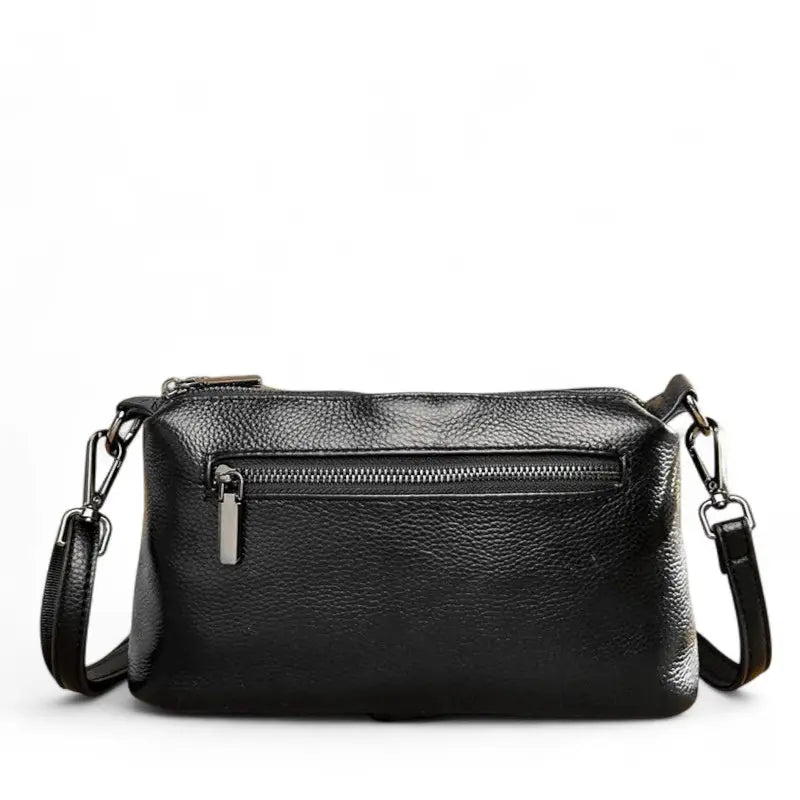Sac bandoulière femme en cuir noir avec poche zippée au dos