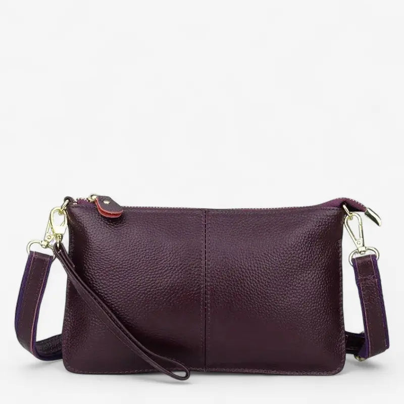 Sac à bandoulière pour femme en cuir violet véritable, vue arrière avec sangle réglable.