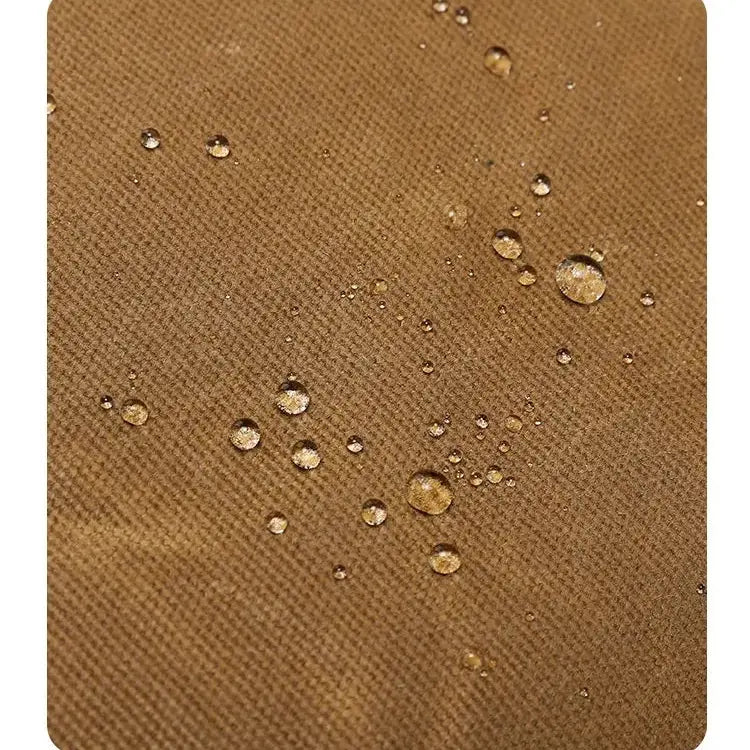 toile déperlante du sac bandoulière homme camel avec gouttes d’eau