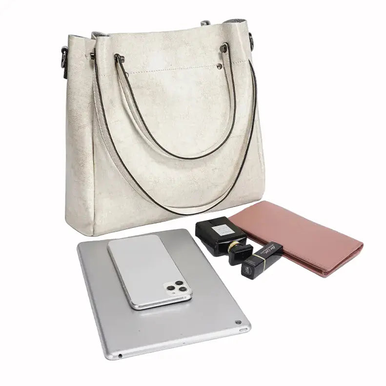 Sac cabas en cuir blanc laiteux pour femme, présenté avec ordinateur portable et smartphone