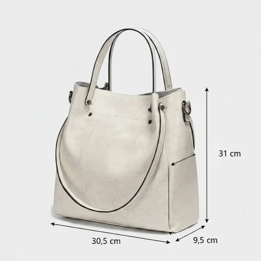 Sac cabas femme blanc en cuir de vachette avec bandoulière ajustable et dimensions 31 x 30,5 x 9,5 cm.