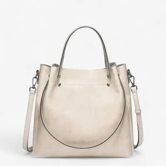 Sac cabas en cuir blanc laiteux pour femme, vue de face avec anses et bandoulière
