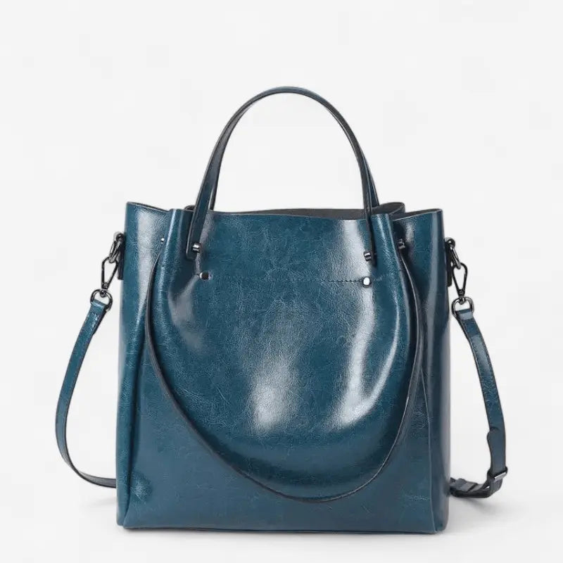 Sac cabas en cuir bleu pour femme, vue de face avec anses robustes et bandoulière