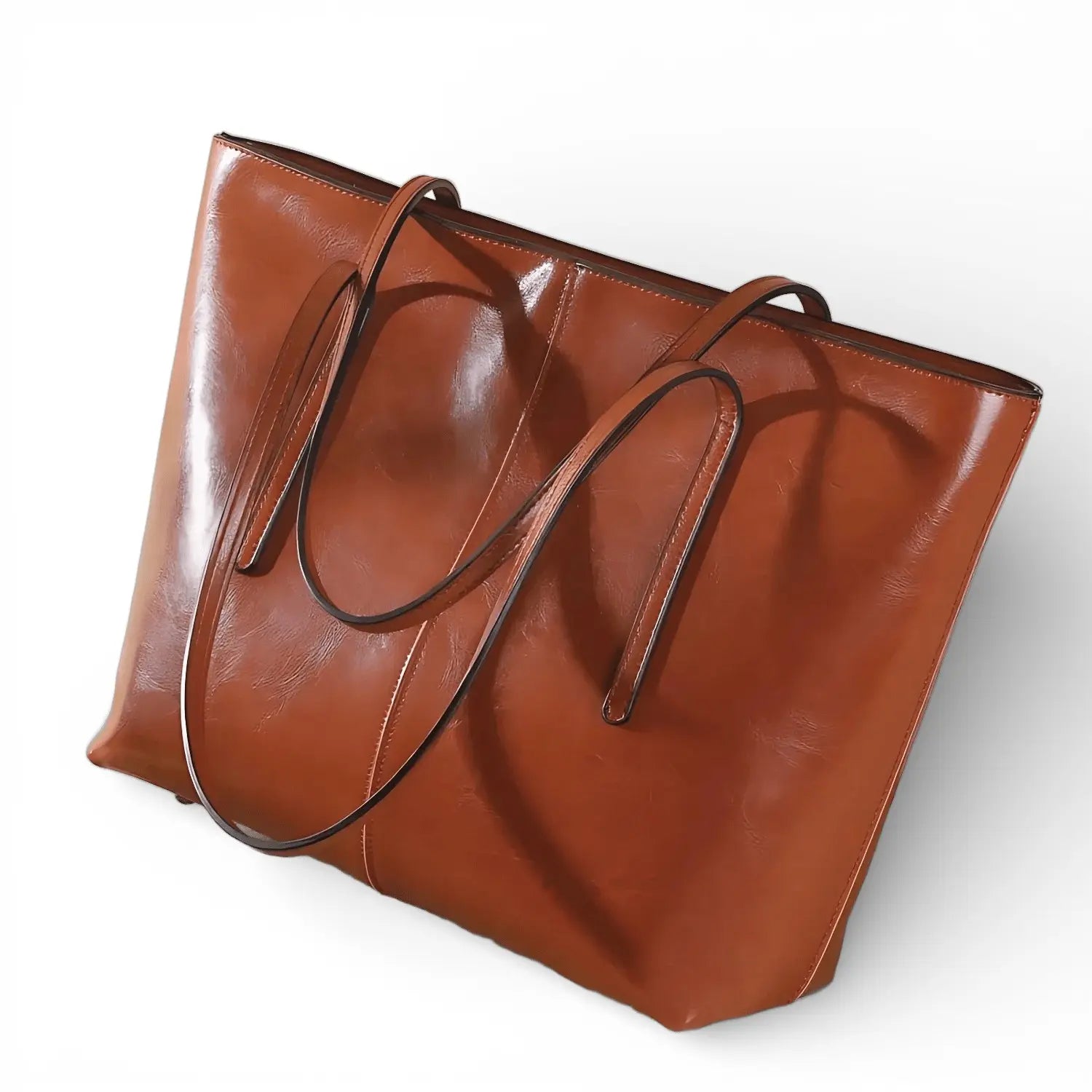 Vue en angle du sac cabas marron en cuir de vachette avec anses