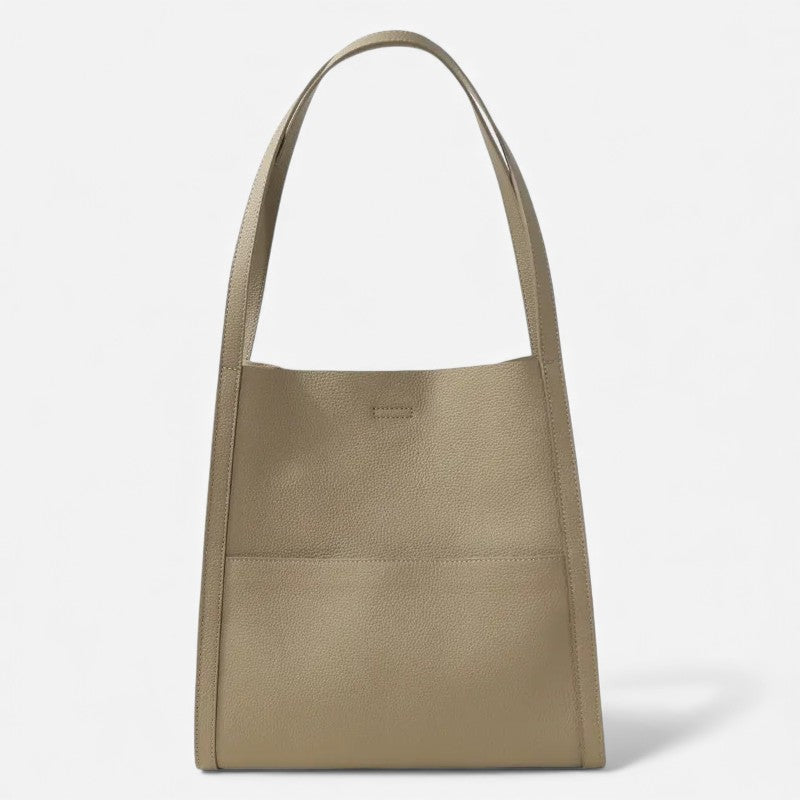 Vue de face du sac cabas en cuir véritable gris avec anses souples et grande poche frontale.