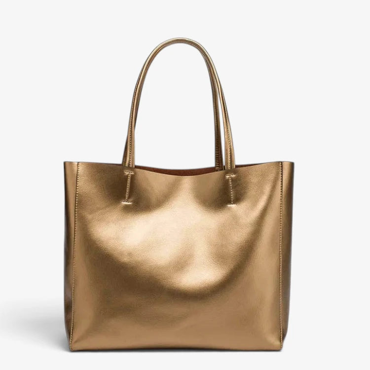 Sac cabas femme en cuir or lumineux avec anses rigides, design structuré.