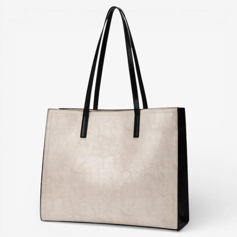 Sac cabas femme en cuir de vachette beige et noir grand format avec double bandoulière porté épaule