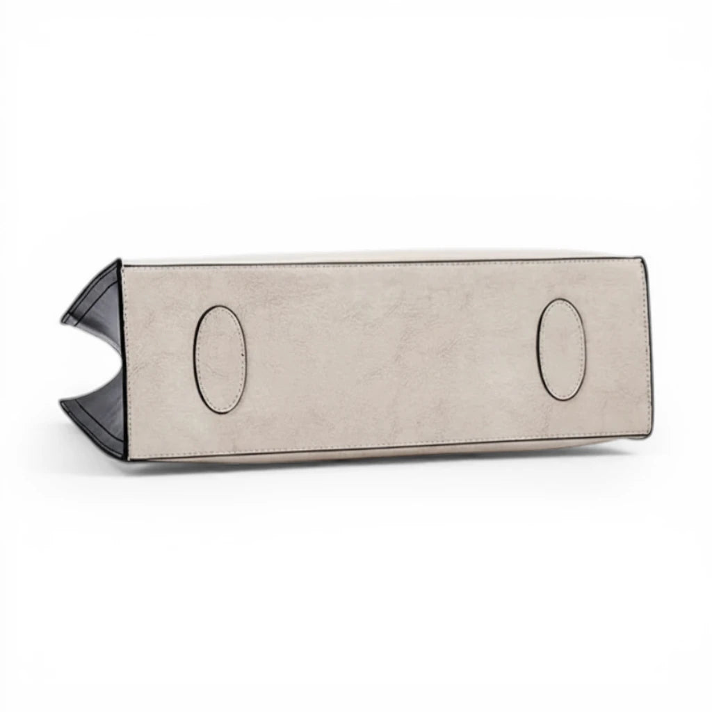 Dessous du sac cabas femme en cuir de vachette avec renforts de protection